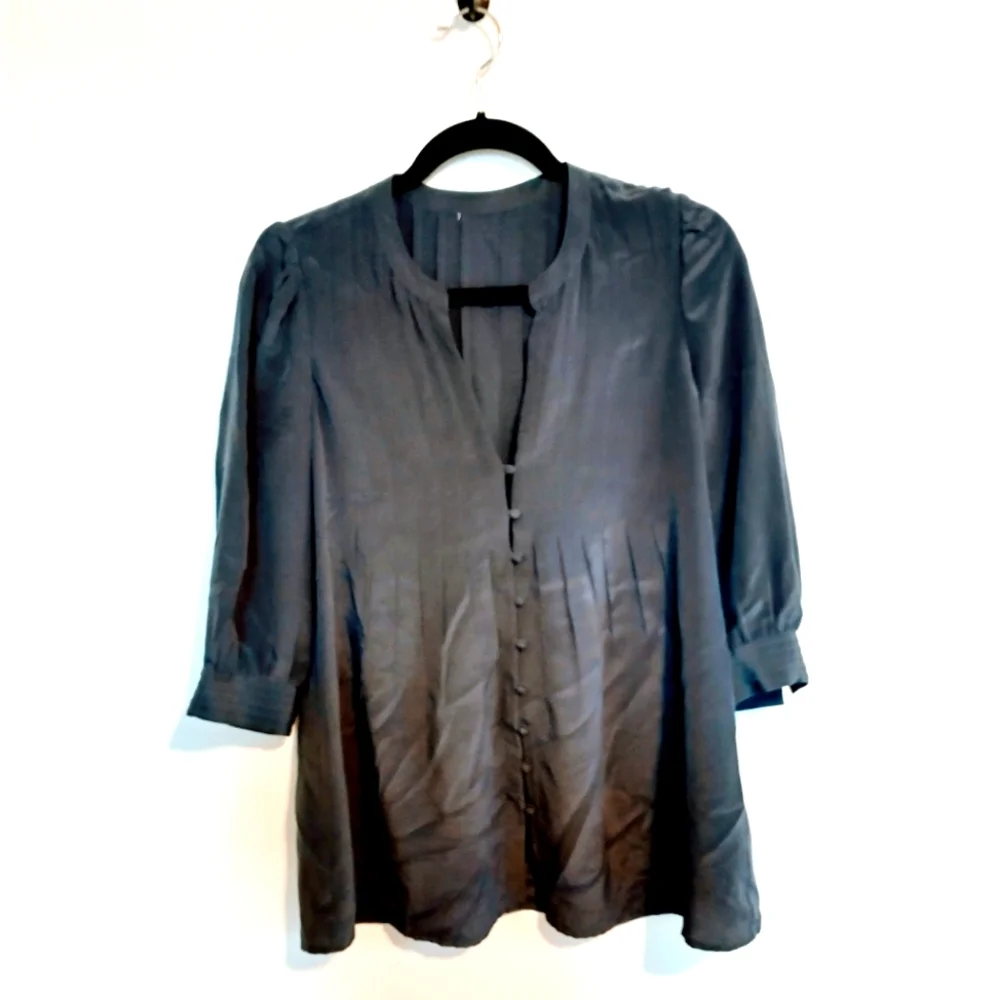 Blue top with front buttons. Tags have been removed. I believe it is jcrew size